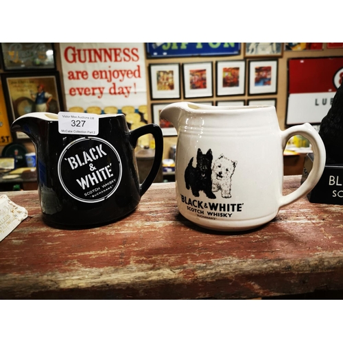 327 - Two Black and White Scotch Whiskey ceramic water jugs  - One by Wade.  { 12cm H }.