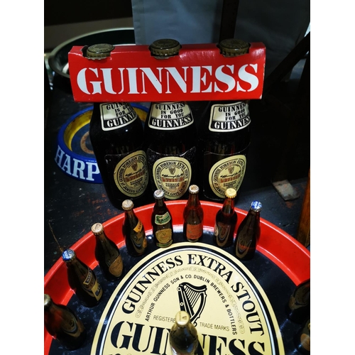 336 - Guinness drink's tray, collection of miniature bottles of Guinness and three pack of Guinness with o... 