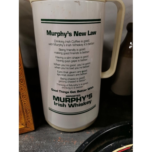 339 - Murphy's  Irish Whiskey  New Law hot water flask. { 26cm H }.