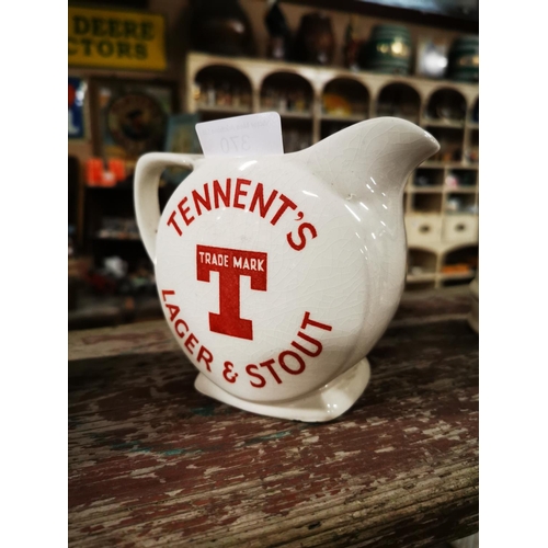 370 - Tennent's Lager and Stout ceramic water jug. { 12cm H }.