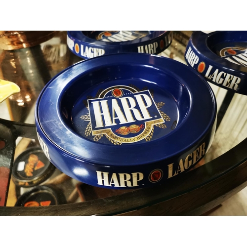 382 - Three Perspex Harp ashtrays.