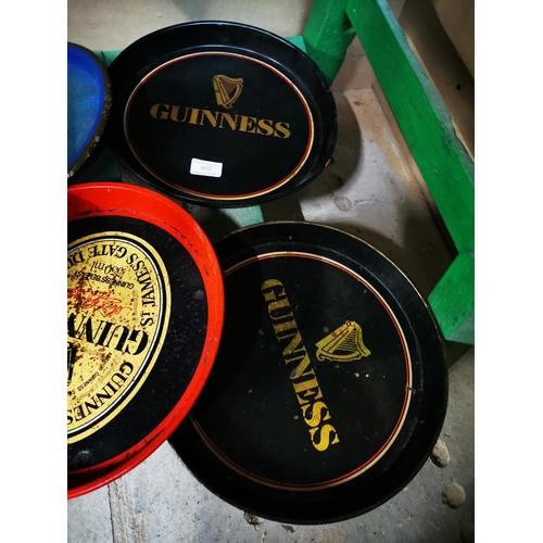 405 - Four Guinness tinplate drink's trays { Each 30cm Dia }.