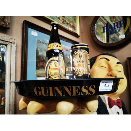 419 - Guinness tinplate drink's tray, { 30cm Dia } bottle, glass and can.