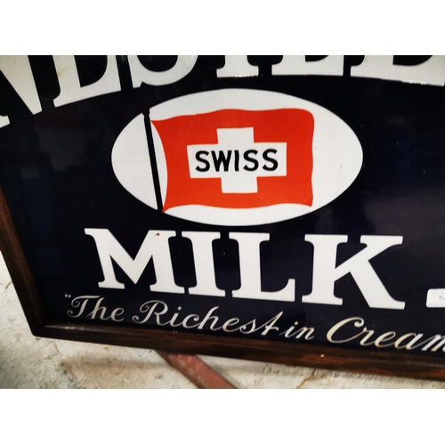 524 - Nestlé's Swiss Milk The Riches in Cream enamel advertising sign. { 48cm H X 63cm W }.