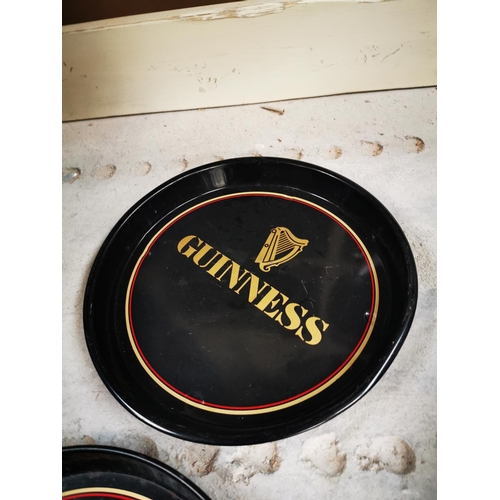 534 - Two tin plate Guinness advertising drinks trays {30 cm H}.