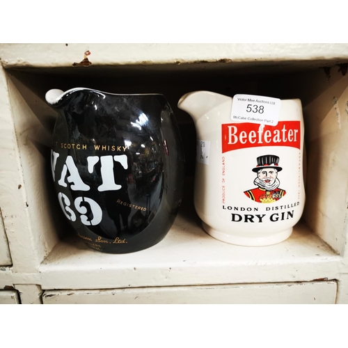 538 - Beefeater Dry Gin & VAT 69 ceramic advertising jugs. { 13cm H smaller. }.