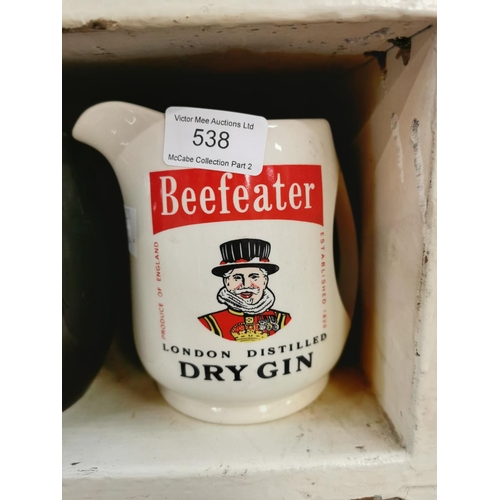 538 - Beefeater Dry Gin & VAT 69 ceramic advertising jugs. { 13cm H smaller. }.