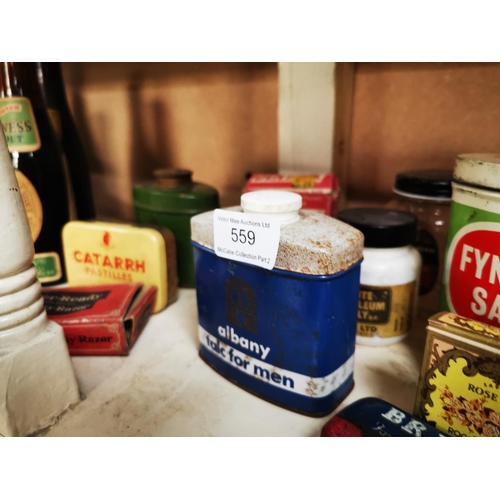 559 - Miscellaneous shelf of tins.