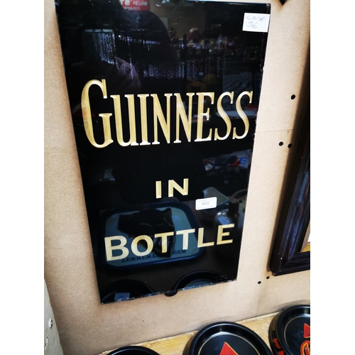 602 - Guinness In A Bottle slate advertising sign. { 51cm H X 28cm W }.