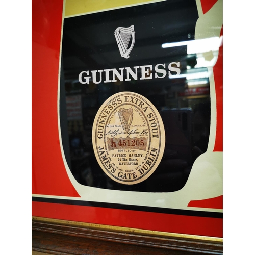 604 - Guinness Patrick Hanley of Waterford framed advertising print {42 cm H x 52 cm W}.