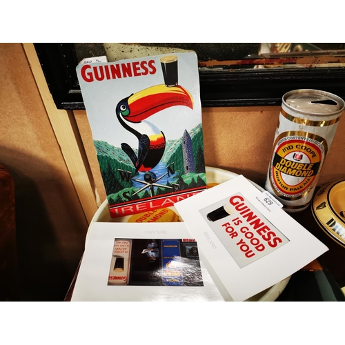 629 - Collection of Guinness memorabilia - postcards, toucan and bottles.