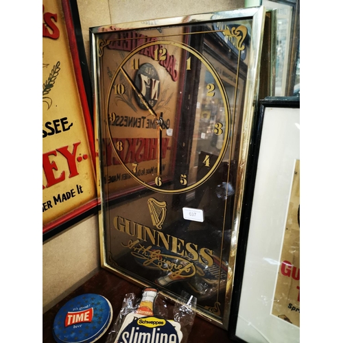 637 - Guinness advertising clock {50 cm H x 31 cm W}.