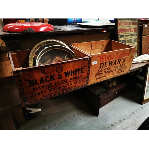 658 - Two advertising crates - Dewar's and Black and White  { 22cm H X 43cm X 30cm each.}.