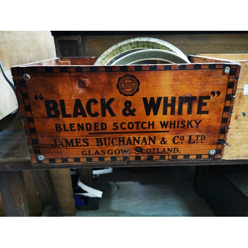 658 - Two advertising crates - Dewar's and Black and White  { 22cm H X 43cm X 30cm each.}.