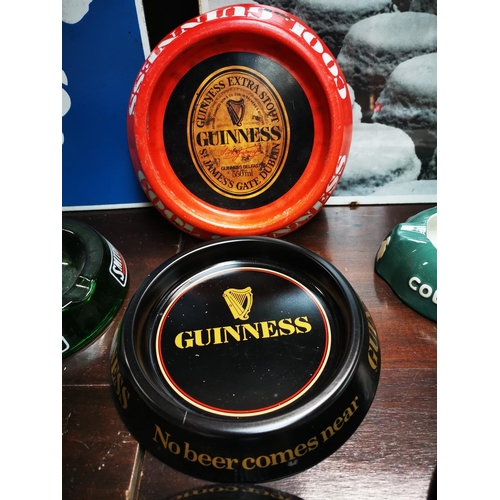 681 - Three Guinness tin plate advertising ashtrays.