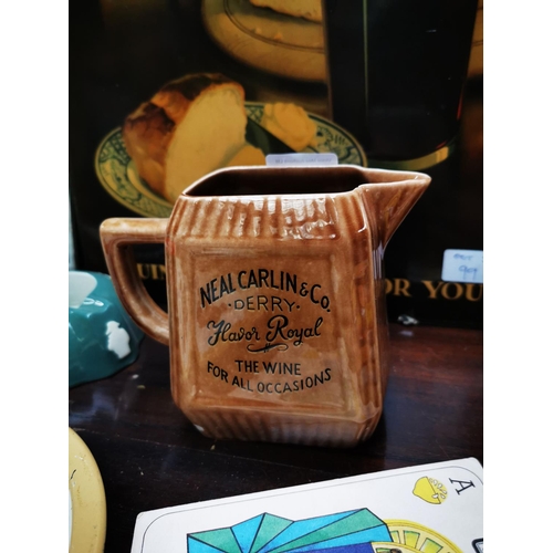 686 - Neal Carlin & Co ceramic advertising water jug. { 12cm H }.