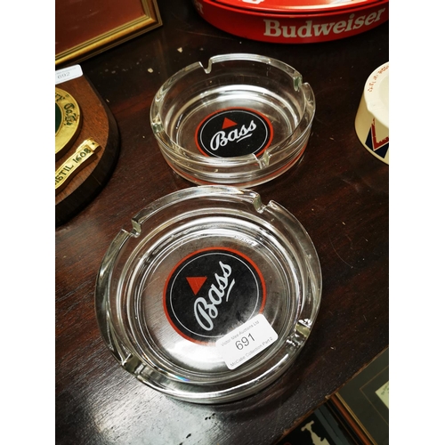 691 - Two Bass glass advertising ashtrays.