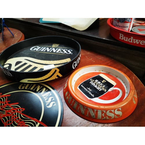 708 - Guinness Perspex advertising drinks tray {31 cm Dia.}, tinplate ashtray and beer mat.