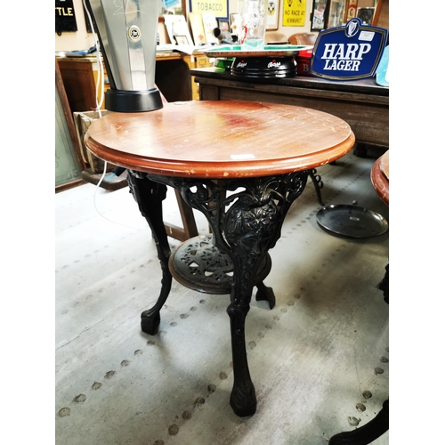 709 - Cast iron and mahogany top pub table {69 cm H x 59 cm Dia.}.