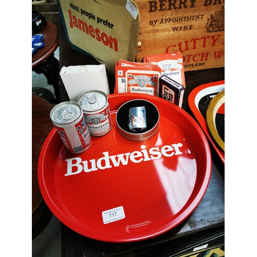 717 - Two Budweiser tinplate advertising tray {32 cm Dia.}, beer mats, two beer tins and brush.