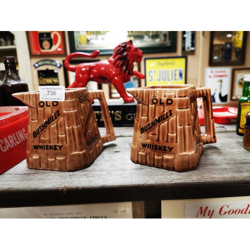 738 - Two Bushmill's whiskey advertising jugs by Arklow pottery.