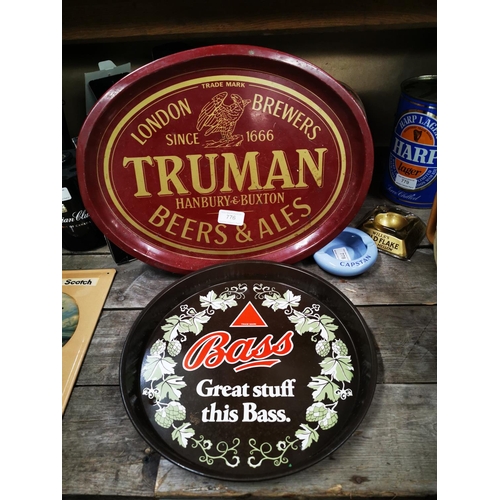 776 - Truman Beer and Ales tinplate drinks tray. {32 cm H x 41 cm L} and Bass tinplate drink's tray