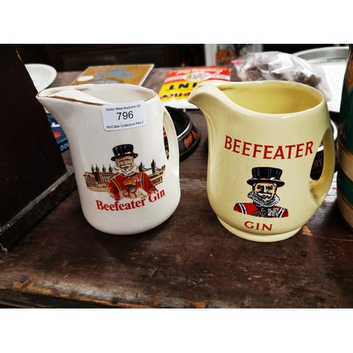 796 - Two Beefeater Gin ceramic Jugs. {14 cm H}.