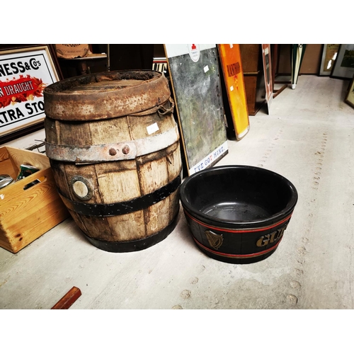 810 - Guinness barrel {53 cm H x 38 cm Dia} and Guinness ice bucket {18 cm H x 35 cm W}.