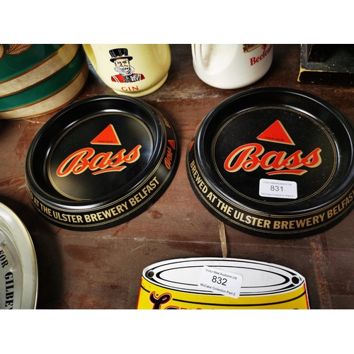 831 - Two tin plate Bass ashtrays and two Double Diamond ashtrays.