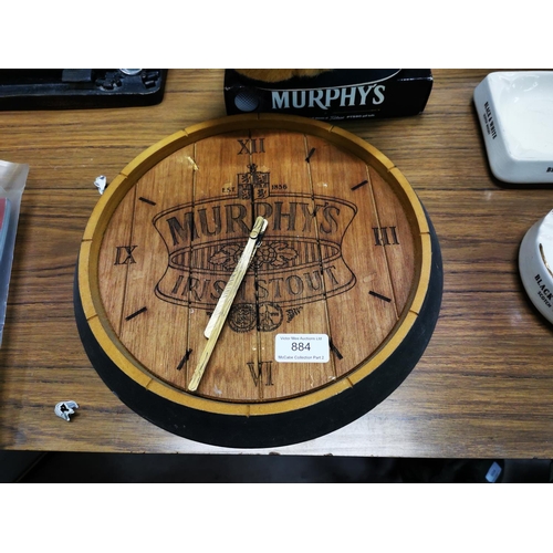 884 - Murphy's Irish Stout wooden advertising clock (32cm Diam).