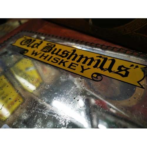 907 - Old Bush Mills advertising mirror. {21 cm H x 27 cm W}.