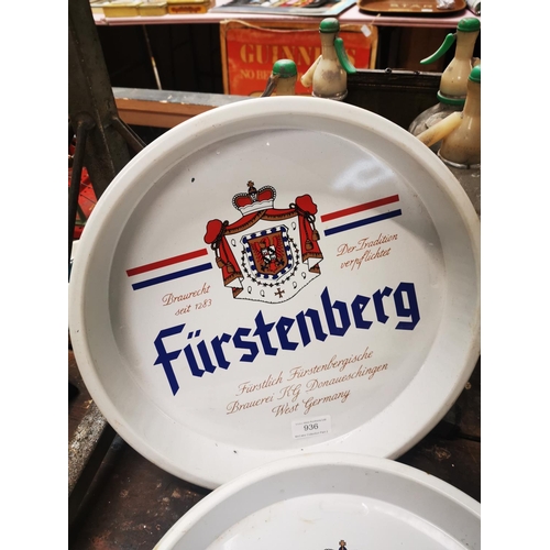 936 - Collection of three Furstenberg tinplate advertising drink's trays {33 cm Dia.}.