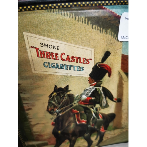 945 - W D & H Will's Smoke Three Castles Cigarettes tinplate advertising sign {25 cm H x 19 cm W}.