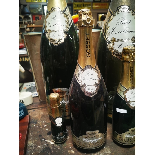 949 - Set of six graduating Gosset display champagne bottles {Largest 63 cm H and Smallest 17cm H}.