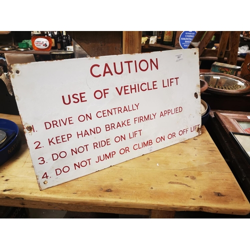 967 - Caution Use of Vehicle Lift warning enamel sign {33 cm H x 61 cm W}.