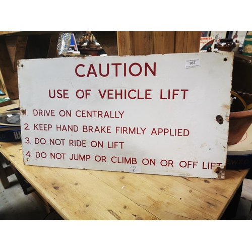 967 - Caution Use of Vehicle Lift warning enamel sign {33 cm H x 61 cm W}.