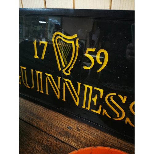 997 - 1759 Guinness advertisement on glass. {34cm H X 63cm W }.