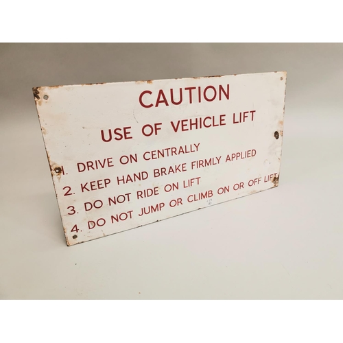 21 - Caution Use of Vehicle Lift warning enamel sign {33 cm H x 61 cm W}.