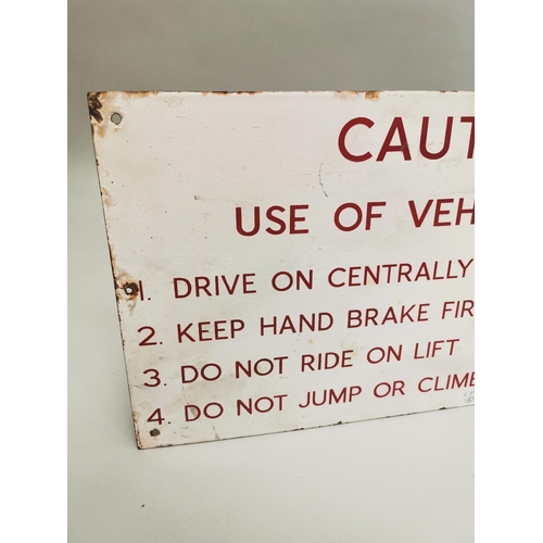 21 - Caution Use of Vehicle Lift warning enamel sign {33 cm H x 61 cm W}.