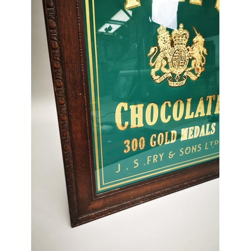 25 - Fry's Chocolate reverse painted glass advertising sign mounted in oak frame {77 cm H x 64 cm W}.