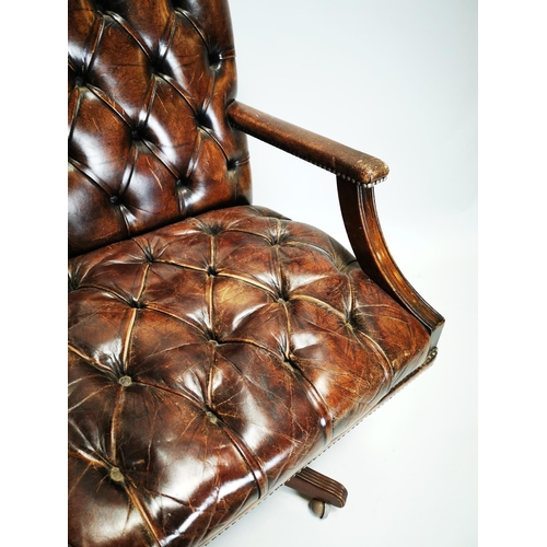 125 - 20th. C. deep buttoned leather upholstered and mahogany swivel desk chair. { 103 H cm X 72cm W X 65c... 