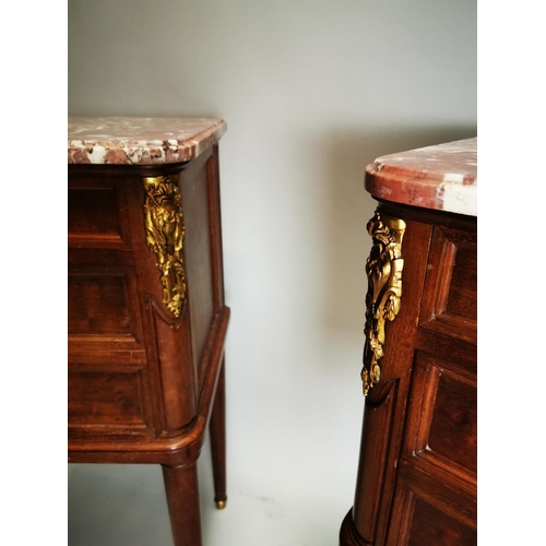 128 - Pair of exceptional quality 19th. C. French mahogany bedside lockers the rouge marble tops above a d... 
