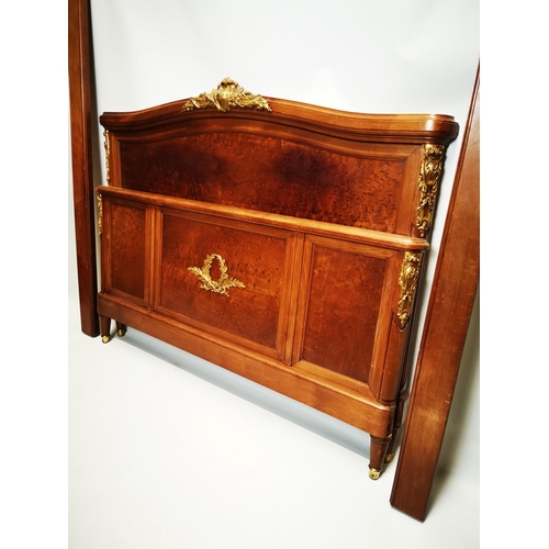 129 - Exceptional quality 19th. C. French mahogany bed decorated with gilded mounts raised on four turned ... 