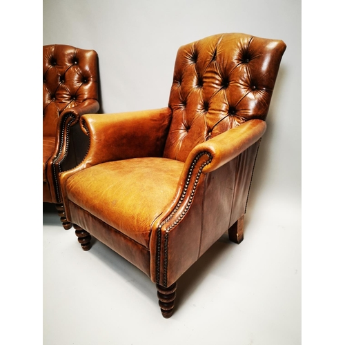 135 - Pair of exceptional quality hand died English leather deep buttoned arm chairs on turned walnut legs... 