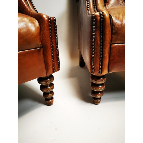 135 - Pair of exceptional quality hand died English leather deep buttoned arm chairs on turned walnut legs... 