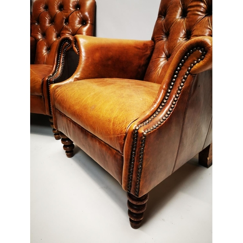 135 - Pair of exceptional quality hand died English leather deep buttoned arm chairs on turned walnut legs... 