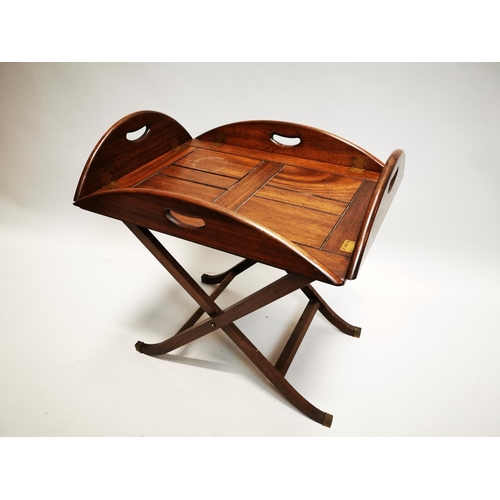 148 - Mahogany coffee table in the form of a butlers tray on stand {57 cm H x 88 cm W x 64 cm D}.