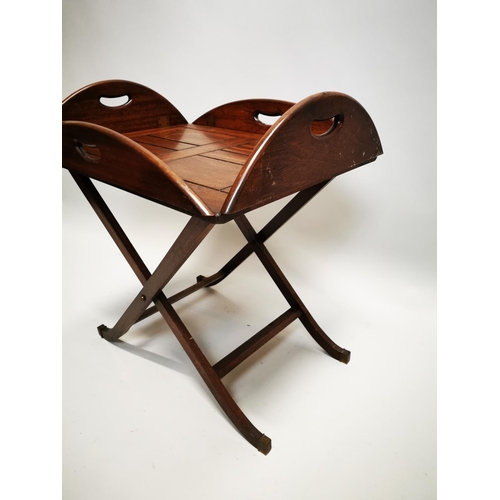 148 - Mahogany coffee table in the form of a butlers tray on stand {57 cm H x 88 cm W x 64 cm D}.