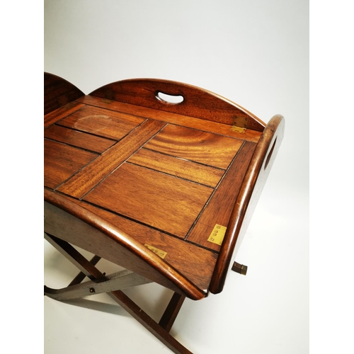 148 - Mahogany coffee table in the form of a butlers tray on stand {57 cm H x 88 cm W x 64 cm D}.