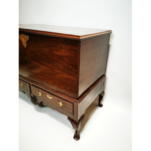 149 - Irish Georgian mahogany chest on stand with two drawers and carved shell in the frieze on cork pad f... 